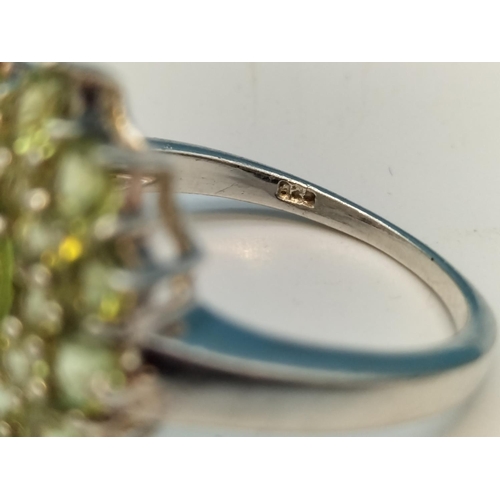 135A - 925 Silver Ring set with Green Stones. Size P.