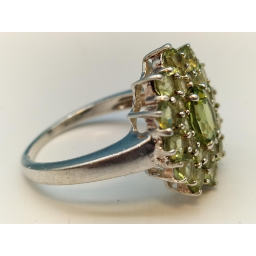 135A - 925 Silver Ring set with Green Stones. Size P.