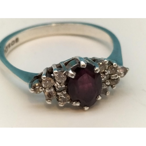 40A - Birmingham Hallmarked Silver Ring set with Garnet and Clear Stones. Size Q.