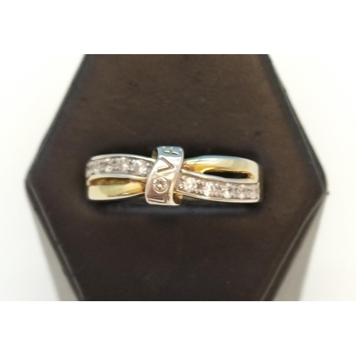 681 - 925 Silver and Cubic Zirconia Crossover Ring. Size P.