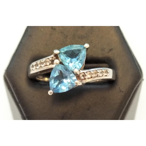 682 - 925 Silver Ring set with Blue and Clear Stones. Size S.