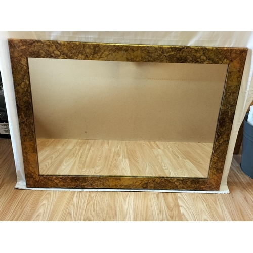 779 - Gold Marble Effect Framed Wall Mirror. 87cm x 62cm. Collection Only.