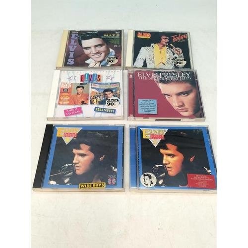 200 - Quantity of Elvis Presley DVDs and CDs.