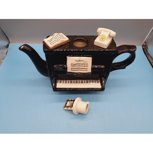 265 - Large Carters of Suffolk 'Tea for Two' Piano Teapot. 23cm High, 32cm x 12cm.