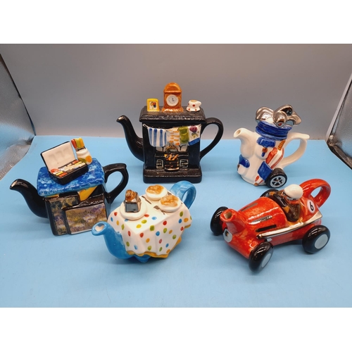 351 - Carters of Suffolk Novelty Teapots (5) to include Racing Car, Golf Bag with Clubs, Artist Table, Bre... 