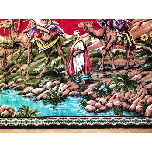 371 - Arabic Fabric Wall Hanging depicting Camels in an Oasis Scene. 172cm x 120cm.