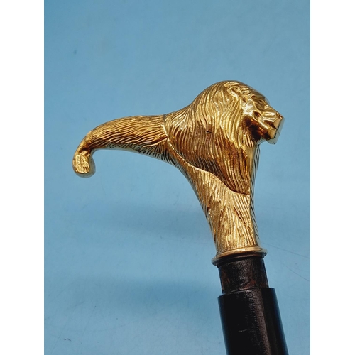 274 - Brass Coloured Lion Head Walking Stick. 94cm Long.