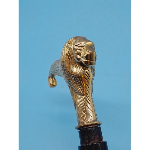 274 - Brass Coloured Lion Head Walking Stick. 94cm Long.