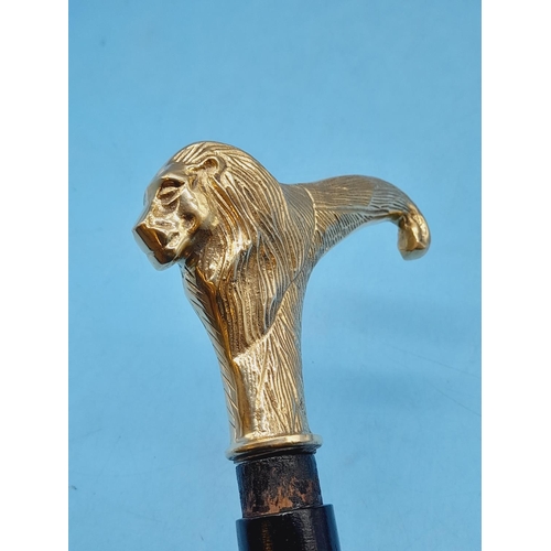 274 - Brass Coloured Lion Head Walking Stick. 94cm Long.