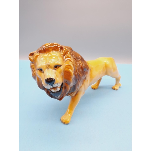 28 - Beswick Figure of a Lion. 14cm High x 25cm.