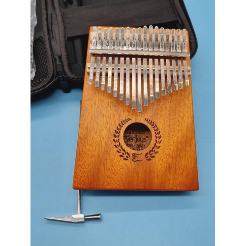 310 - Cased Kalimba Thumb Piano. Model A027. Piano Measures 18cm x 13cm.