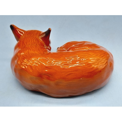 46 - Beswick Figure of a Lying Fox. 10cm x 9cm.