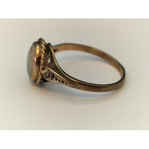 632 - 9ct Gold and Opal Ring. Size M.