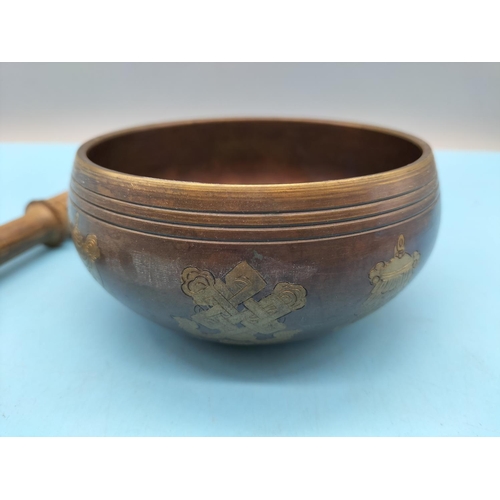 413 - Copper and Brass Sound Bowl with Wooden Elephant Striker. Bowl measures 6cm high, 12cm Diameter.