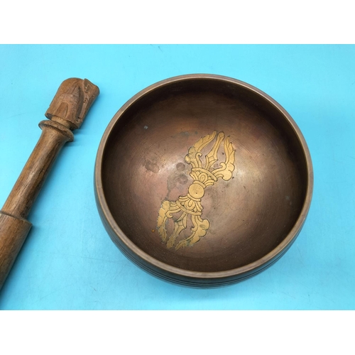 413 - Copper and Brass Sound Bowl with Wooden Elephant Striker. Bowl measures 6cm high, 12cm Diameter.