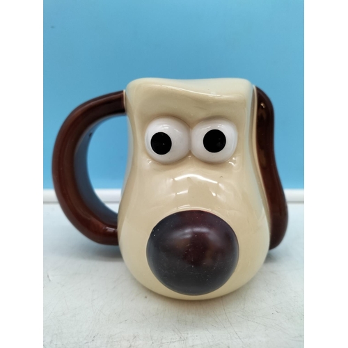 418 - Dog Figures (3) plus Gromit Mug. Largest Dog 13cm High x 18cm.