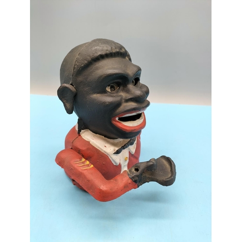 84 - Cast Metal Hand to Mouth Golly Money Box. 16cm Tall.