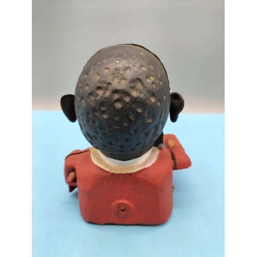 84 - Cast Metal Hand to Mouth Golly Money Box. 16cm Tall.