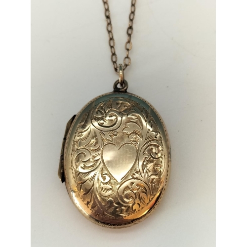 423 - 9ct Gold Front and Back Locket on Yellow Metal Chain.