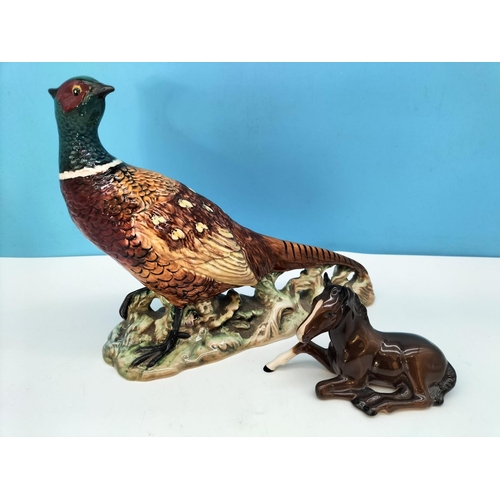 48 - Beswick Figure of a Pheasant 1225 and Laying Foal 915. Tallest 19.5cm.