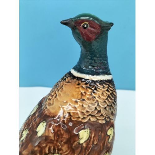 48 - Beswick Figure of a Pheasant 1225 and Laying Foal 915. Tallest 19.5cm.