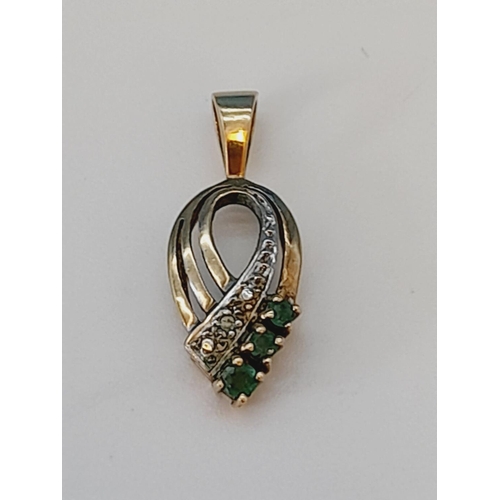 37 - 9ct Gold Diamond and Emerald set Pendant. 1.4 Grams.