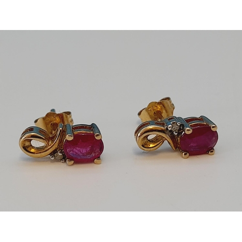 63 - Pair of 9ct 375 Gold, Diamond Chip and Red Stone Earrings. 1.1 Grams.