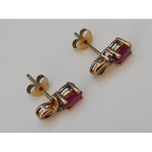 63 - Pair of 9ct 375 Gold, Diamond Chip and Red Stone Earrings. 1.1 Grams.