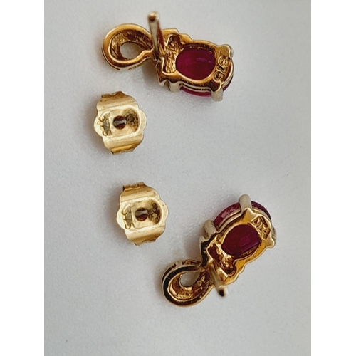 63 - Pair of 9ct 375 Gold, Diamond Chip and Red Stone Earrings. 1.1 Grams.