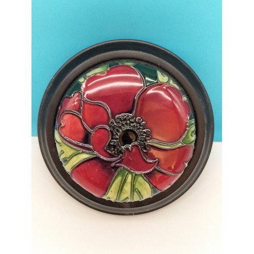 38 - Moorcroft 'Anemone' Paperweight on Wooden Base. 11cm Diameter.