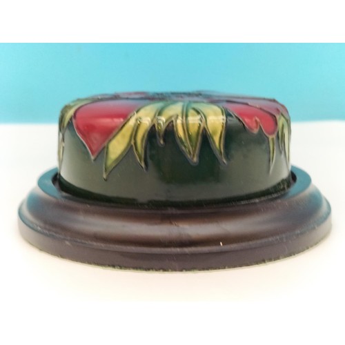 38 - Moorcroft 'Anemone' Paperweight on Wooden Base. 11cm Diameter.