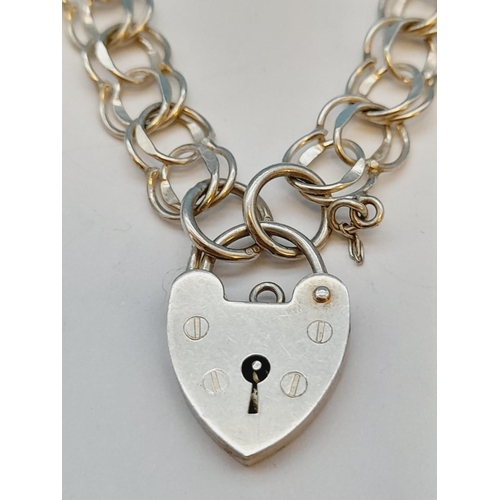 28 - Silver Hallmarked (London) Padlock Bracelet. 8.25g