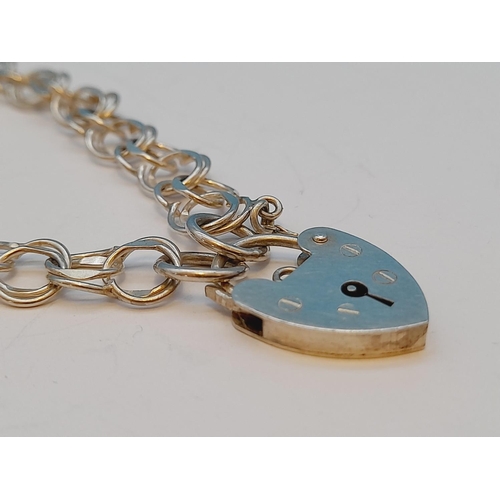 28 - Silver Hallmarked (London) Padlock Bracelet. 8.25g