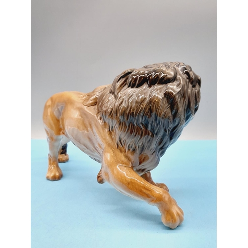 41 - Beswick Figure of a Lion. 17cm High x 28cm.