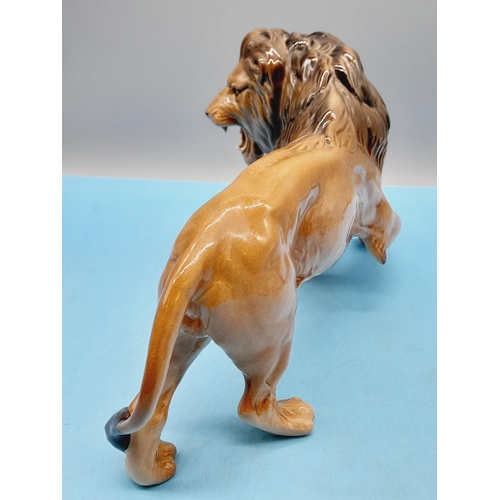 41 - Beswick Figure of a Lion. 17cm High x 28cm.