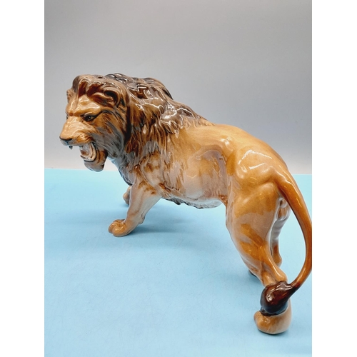 41 - Beswick Figure of a Lion. 17cm High x 28cm.