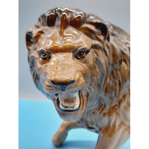 41 - Beswick Figure of a Lion. 17cm High x 28cm.