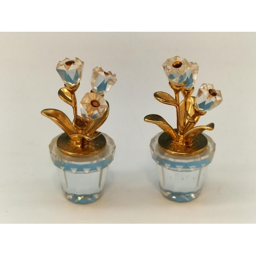 139 - 2 x Swarovski Crystals Memories Flowers in Pots with Gold Tone Leaves. 4cm High.