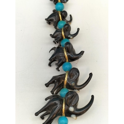 143 - Unusual Murano Hanging Black Glass Elephants. 20cm Long. Slight Damage to One Trunk.