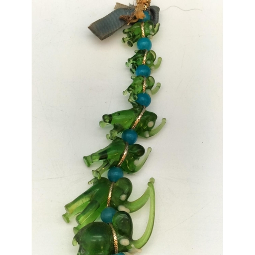 144 - Unusual Murano Hanging Green Glass Elephants. 20cm Long.