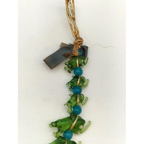 144 - Unusual Murano Hanging Green Glass Elephants. 20cm Long.