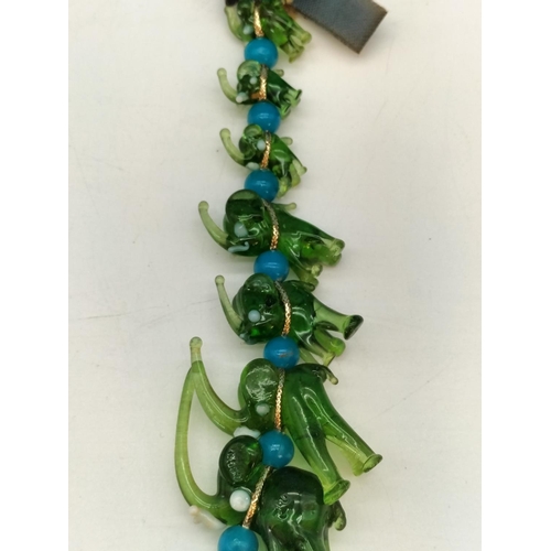 144 - Unusual Murano Hanging Green Glass Elephants. 20cm Long.