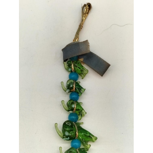 144 - Unusual Murano Hanging Green Glass Elephants. 20cm Long.