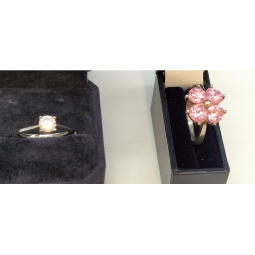 231 - 925 Silver Rings (2) - Pink 4 Stone (Size O) and Clear Stone (Size L).