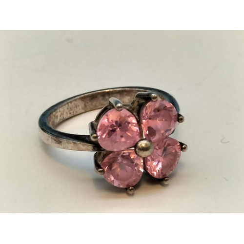 231 - 925 Silver Rings (2) - Pink 4 Stone (Size O) and Clear Stone (Size L).