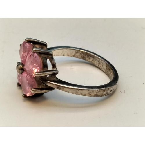 231 - 925 Silver Rings (2) - Pink 4 Stone (Size O) and Clear Stone (Size L).