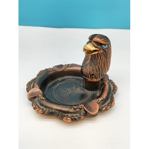 275 - Copper Coloured Eagle Head Lighter on Ashtray, 14cm Diameter.