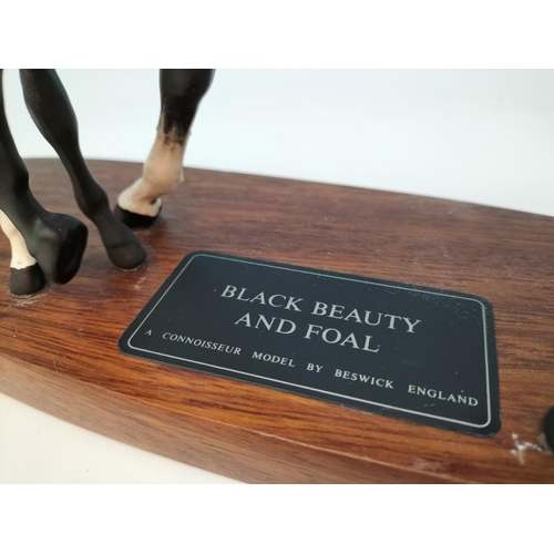 514 - Beswick Figure of Black Beauty and Foal on Plinth. A/F Repair to Leg and Ear. 20cm High, 30cm x 10cm... 