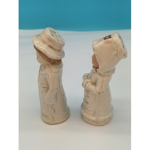 174 - 19th Century Continental Porcelain Shakers Modelled as a Young Boy and Girl.