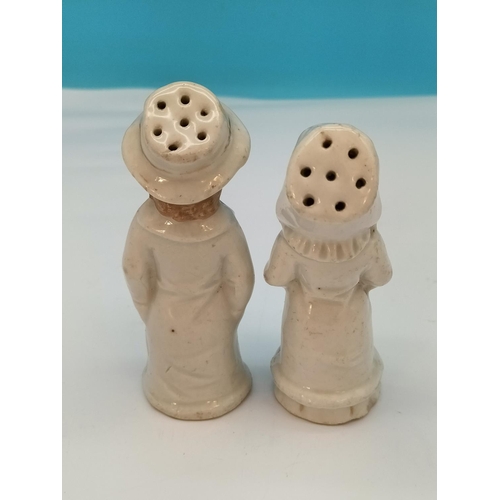 174 - 19th Century Continental Porcelain Shakers Modelled as a Young Boy and Girl.